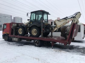 Перевозка экскаватора погрузчика в СПб и Ленинградской области 